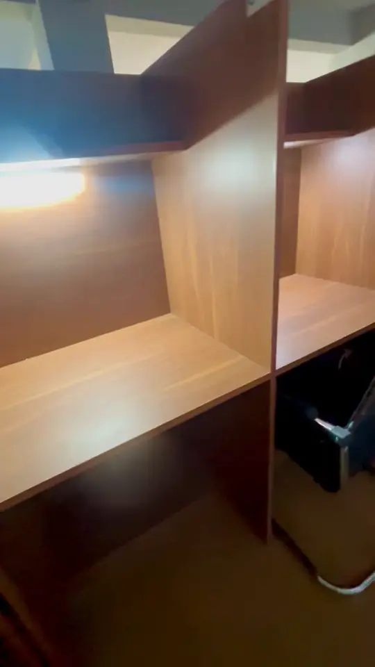 Video close-up of a cabin desk lit by its own lamp.