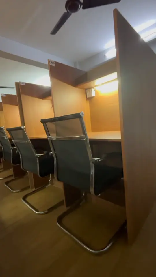 Video walking along a row of wooden cabins.