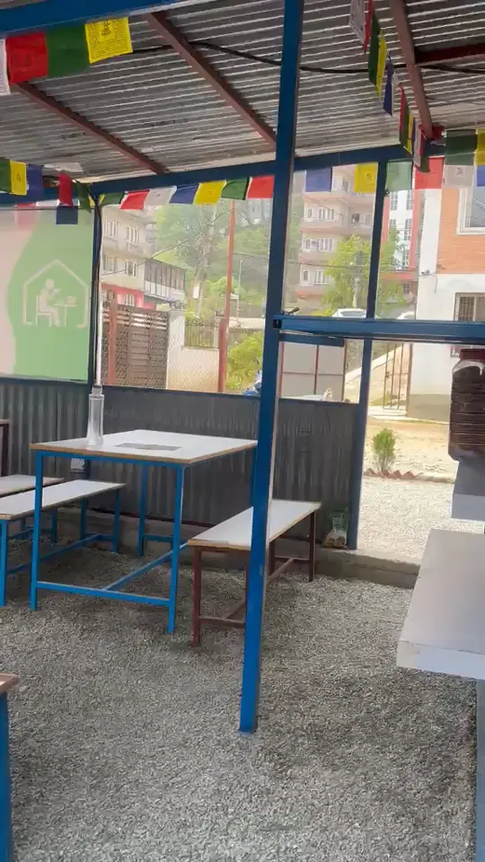 Video of the outdoor break area under prayer flags.